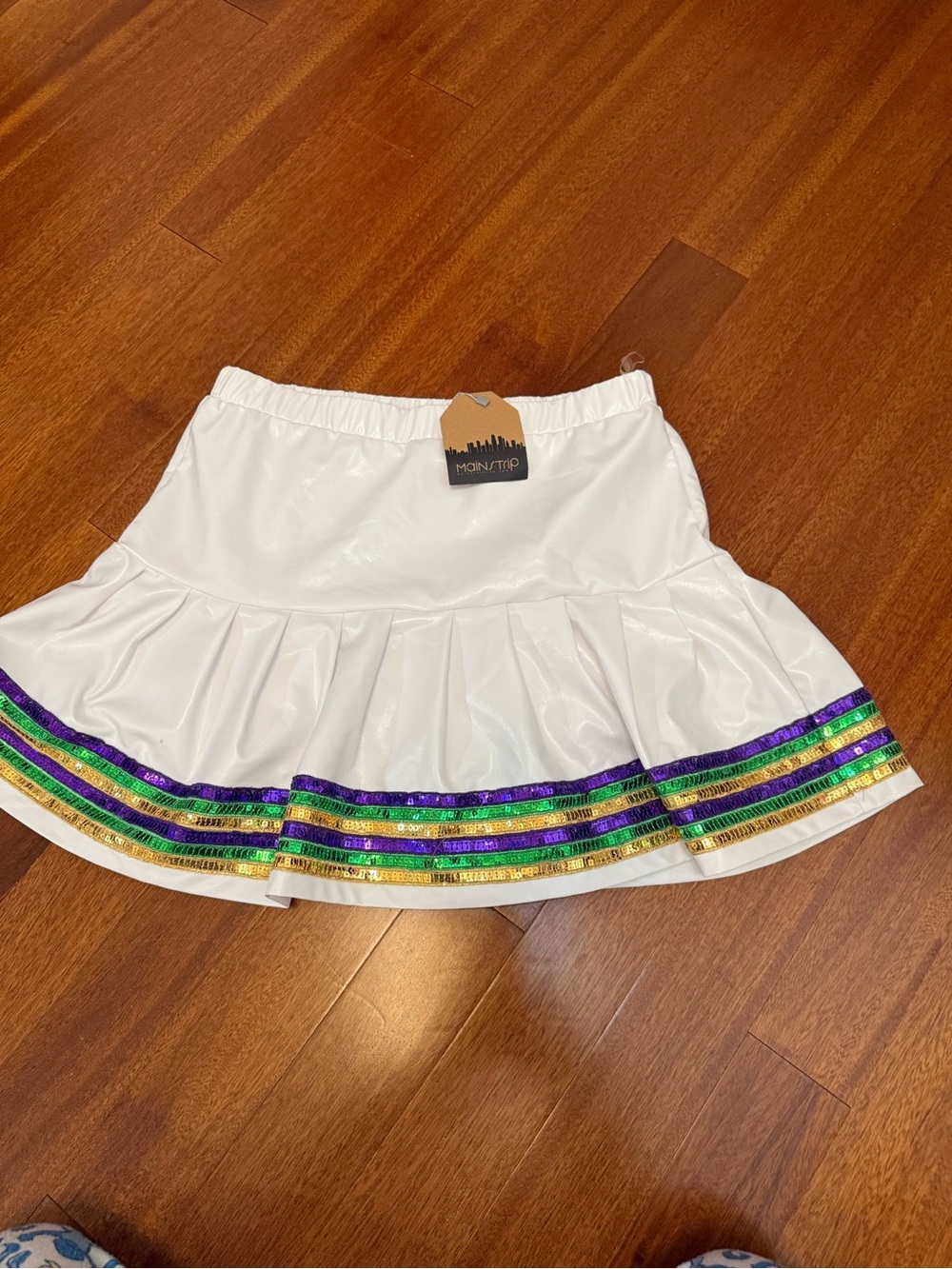 Main Strip White Pleated Mini Skirt with Green, Purple & Gold Stripe Trim